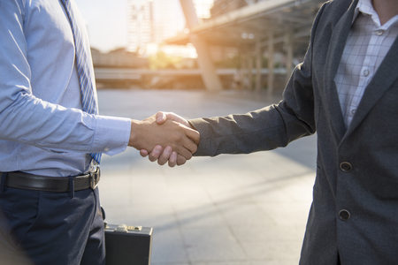 Teamwork concept. friendship business mans shaking hands together. success deal.の写真素材