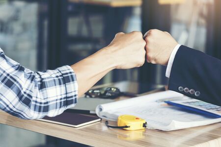 Business Partners Giving Fist Bump after complete a deal. Successful Teamwork Hands Gesture Concept....