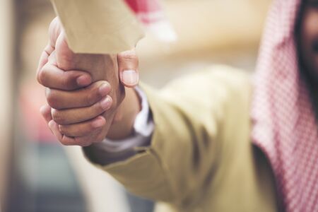 Arab man Teamwork Shake Hands Partnership Concept.
