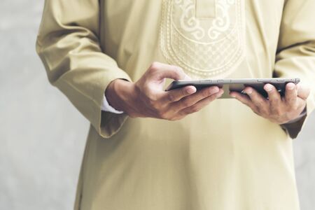 Handsome modern arab man showing credit card