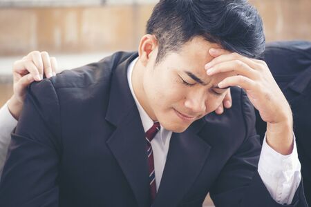 Upset Failure businessman. Friends always supportの写真素材