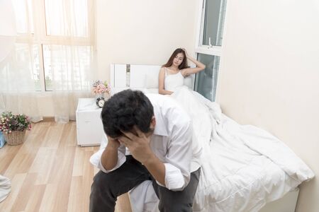 Love couple using condom for safe sex. birth control. lover concept.の写真素材