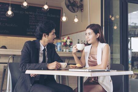 Beautiful business woman fall in love  talking with boyfriend. Best friendsの写真素材