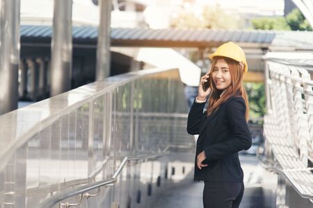 Business man building contractor using smart phone. Architect Interior design.の写真素材