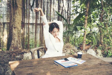 Beautiful woman relax stretching arm over head. Relax Conceptsの写真素材