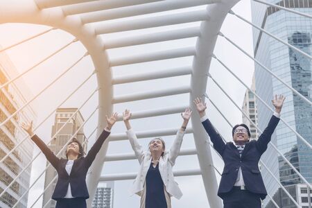 Teamwork Together Concept. Group of diversity people high five on air to greeting power of tag team. Multiethnic people group working togetherness. Volunteer collaboration in Business Team successの写真素材
