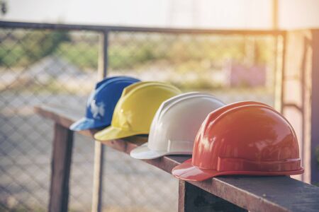 Construction hard hat safety tools equipment for workers in construction site for engineering protection head standard. Many hard hat helmet on row with copy space. Engineering Construction Conceptの写真素材