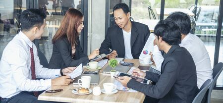 Asian Teamwork Collaboration Team Meeting Communication concept with Business people Working Together in Conference Room. Diversity Partner Business Meeting brainstorming togeter Businessman and Teamの写真素材