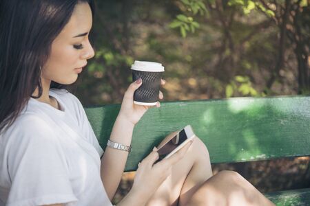 Asian woman using phone shopping online website on smart tablet hand point touch screen digital tablet. Woman holding smartphone checking mail online shopping website read article vlog social mediaの写真素材