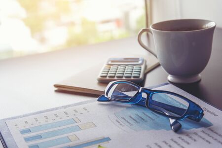 Excel graph with Spreadsheet Document showing Information Financial Startup Concept. Financial Planning making Accounting Database Report. Graphs and chart on screen with stationery set business stuffの写真素材