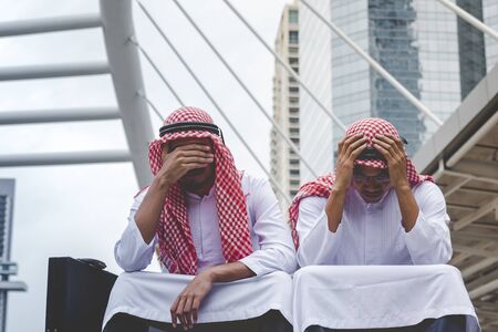 Unemployed jobless arabian businessman recession crisis stress losing job. Diversity arabian man despair office stressful depress. Despair economic world crisis from covid-19 coronavirus pandemicsの写真素材
