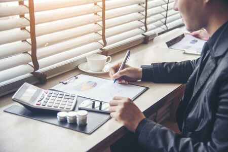 Collaboration worker in office working together with Excel graph with Spreadsheet Document showing Information Financial Startup business. Financial Planning on profit budget of accounting project.の写真素材