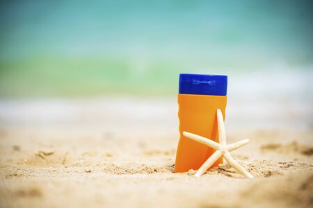Sunscreen lotion protect woman skin under sunlight burn with uv spf moisturizer on tropical summer outdoor beach. Cosmetic sunblock water resistant tanning wellness factor for woman sunscreen lotionの写真素材