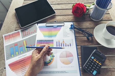 Excel graph with Spreadsheet Document showing Information Financial Startup Concept. Financial Planning making Accounting Database Report. Graphs and chart on screen with stationery set business stuffの写真素材