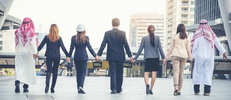 Group of people diversity multiethnic teamwork collaboration team meeting communication  Unified team concept. Business people hands together diversity multiethnic diverse culture partner team meetingの写真素材