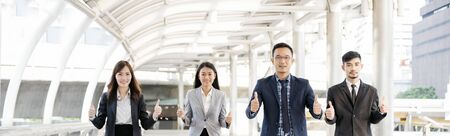 Asian diversity multicultural business corporate people group outdoor in modern city. Diversity coworkers team talking trust in partnership. Consultant colleague business people meeting conceptの写真素材