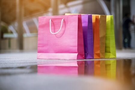 Shopping bags of women crazy shopaholic person at shopping mall indoor. Fashionable Woman love online website with sales tag on black friday. E-commerce digital marketing lifestyle Conceptの写真素材