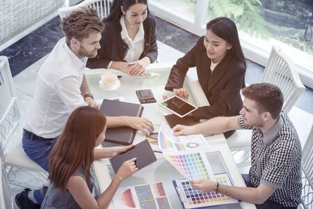 Multi Ethnics Teamwork Collaboration Team Meeting Communication concept in Business people Working Together Conference Room. Diversity Partner Business Meeting brainstorming together Businessman Teamの写真素材