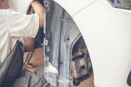 Mechanic man car service repair automobile garage autocar vehicles service mechanical man engineering. Automobile mechanical close up hands fixing car repairs. Mechanic technician workshop centerの写真素材