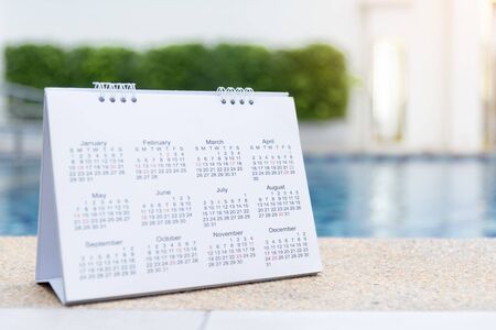 2019 Calendar Close up calendar setting timetable for organize schedule. Time management concept. Calendar timetable with timeline planning on swimming pool as a background.の写真素材
