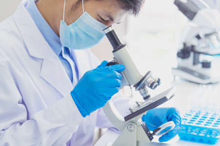 Scientist covid-19 virus antibody sample in laboratory research experiment biotech make cultivate...
