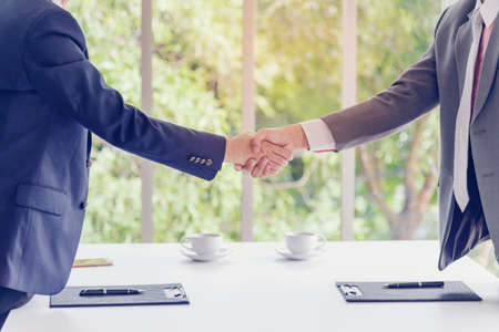 Sustainable Partner trust mission of ecosystem plant business holding green plant together symbolism of green business company with development ecology concept. Sustaining partner trust hands togetherの写真素材