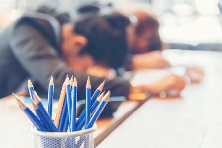 Pencil sharp and unsharp selective focus in meeting room when staff lazy and sleep.の写真素材