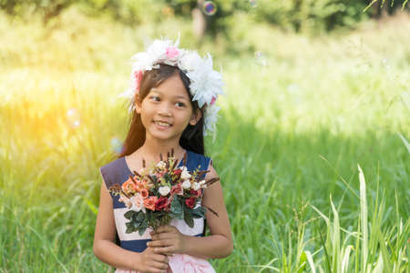 Smiling girl with happy face relaxation in garden.の写真素材
