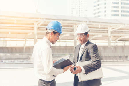 Business teamwork discussing on site. Interior design consulting with building contractor....