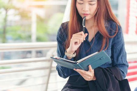 Agenda of planner woman schedule and organize appointment 2020 Calendar Event. Smart Business woman note and schedule to set timetable organize schedule. Woman hands writing on Agenda.Timeline conceptの写真素材