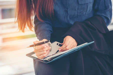 Agenda of planner woman schedule and organize appointment 2020 Calendar Event. Smart Business woman note and schedule to set timetable organize schedule. Woman hands writing on Agenda.Timeline conceptの写真素材