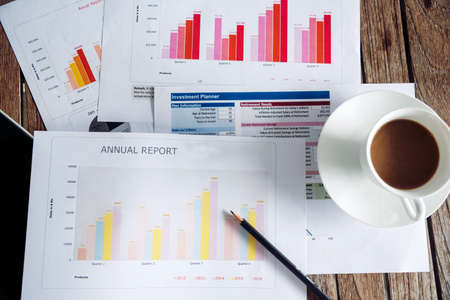 Excel graph with Spreadsheet Document showing Information Financial Startup Concept. Financial Planning making Accounting Database Report. Graphs and chart on screen with stationery set business stuffの写真素材