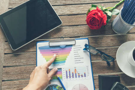 Excel graph with Spreadsheet Document showing Information Financial Startup Concept. Financial Planning making Accounting Database Report. Graphs and chart on screen with stationery set business stuffの写真素材