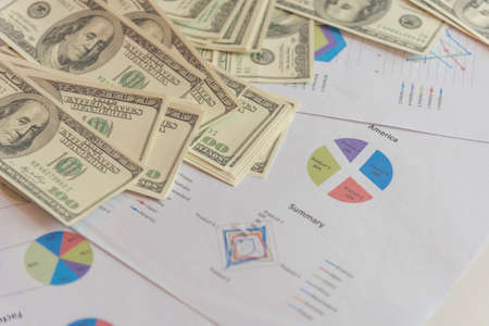 Hand holding loan money dollar bank note give financial payment. Man hands showing spread 100 dollar exchange cash payout. Saving Businessman counting money banknote  bribe corruption concept.の写真素材