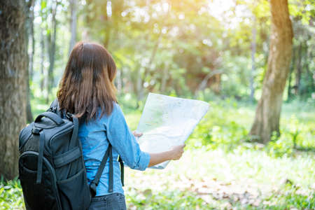 Happy hipster asian tourist travel in Asia backpack with smiling face and happiness laugh. Beautiful woman backpack around the word. Young traveller concept. Young traveller lifestyleの写真素材