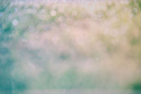 Blur background bokeh for christmas festival event party in auditorium hall convention audience present display goods products on shelf. Blurry abstract background with copy space template bannerの写真素材