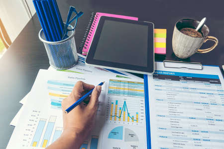 Excel graph with Spreadsheet Document showing Information Financial Startup Concept. Financial Planning making Accounting Database Report. Graphs and chart on screen with stationery set business stuffの写真素材