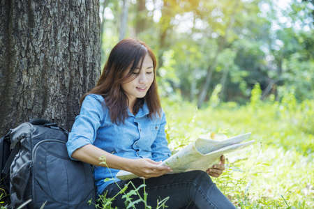 Happy hipster asian tourist travel in Asia backpack with smiling face and happiness laugh. Beautiful woman backpack around the word. Young traveller concept. Young traveller lifestyleの写真素材