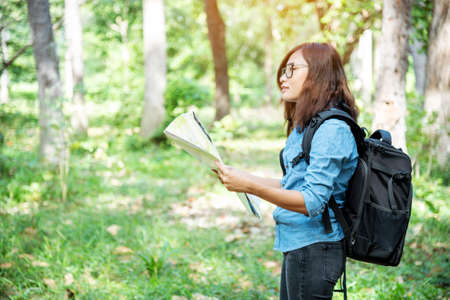 Happy hipster asian tourist travel in Asia backpack with smiling face and happiness laugh. Beautiful woman backpack around the word. Young traveller concept. Young traveller lifestyleの写真素材