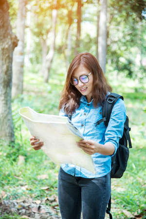 Happy hipster asian tourist travel in Asia backpack with smiling face and happiness laugh. Beautiful...