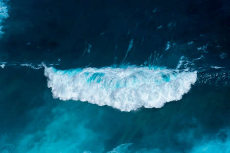 Summer tropical beach white sand blue sea summertime on sunny day. Sea coast beach scenery foamy wave on the beach waves of blue sea tropical ocean sand. Travel holidays vacation seaside turquoise .の写真素材