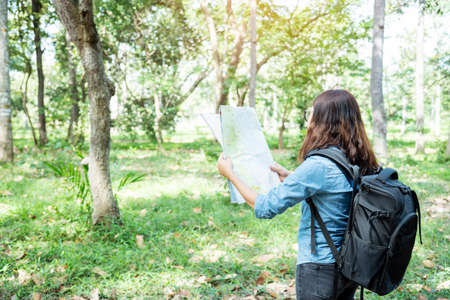 Happy hipster asian tourist travel in Asia backpack with smiling face and happiness laugh. Beautiful woman backpack around the word. Young traveller concept. Young traveller lifestyleの写真素材