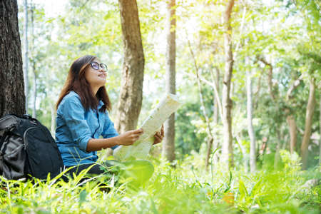Happy hipster asian tourist travel in Asia backpack with smiling face and happiness laugh. Beautiful woman backpack around the word. Young traveller concept. Young traveller lifestyleの写真素材