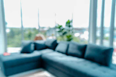 Cozy sofa furniture in living room interior design decorate with clean design space clock, cactus and comfort pillow trendy decor accessories. Comfortable couch lifestyle in japanese green clean houseの写真素材