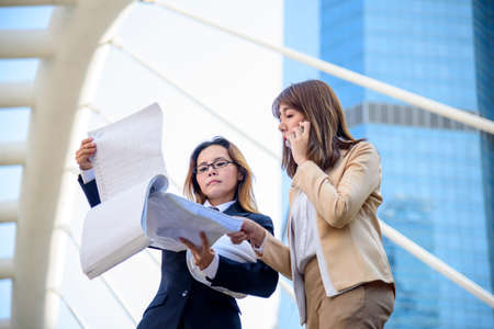 Group diversity partner business meeting trust in businessman and womamn talking together modern city asian Teamwork Collaboration Team Meeting Communication concept with Business people Working Togetherの写真素材