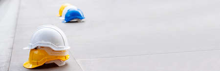 Construction hard hat safety tools equipment for workers in construction site for engineering protection head standard. Many hard hat helmet on row with copy space. Engineering Construction Conceptの写真素材