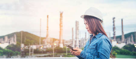 Woman engineer entrepreneur construction industry worker. Female engineer working refinery oil plant...