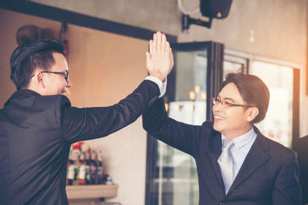 Congratulation to collaboration partner after sign on contract. Diverse Businessman shake hands together with businessman to introduce meeting. Trustworthy student friends meeting. Business Conceptの写真素材