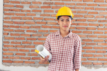 Woman construction engineer wear safety white hard hat at construction site industry worker. Female...