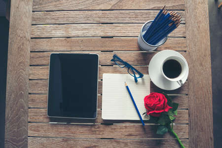 Top view office desk laptop and coffee cup on wood table copy space. Tabletop notebook laptop coffee cup for officer display empty space on wooden background. Home business work from home workspaceの写真素材
